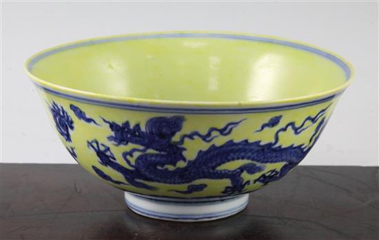 A Chinese yellow ground dragon and phoenix bowl, Xuande six character mark and possibly of the period, 19.5cm, museum restoration, sc